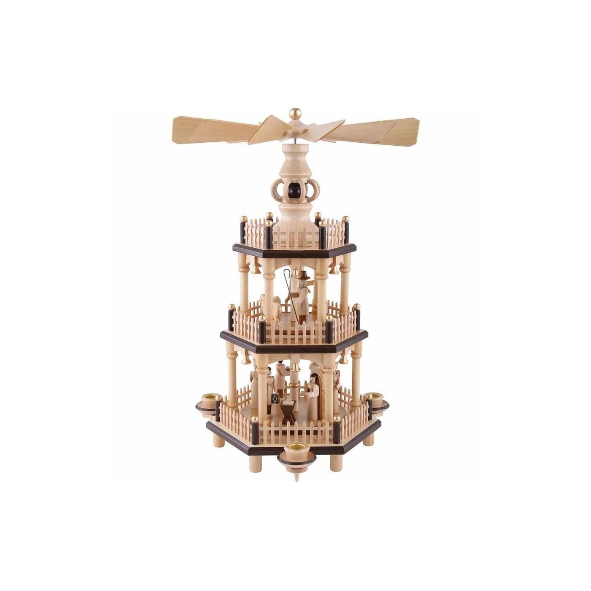 This beautiful Christmas pyramid holds a candle on each of the sides. It features three tiers with round spinning platforms in the middle on angular shaped fenced tiers. The first tier shows the nativity scene, a shepherd, angel and three sheep on the second tier. The third tier features carved designs.