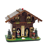 A Black Forest couple are the inhabitants of this weather house in the style of a log cabin. When the sun is shining you can see the woman, when it rains the man comes out of the house. Between the two passages there is a thermometer.