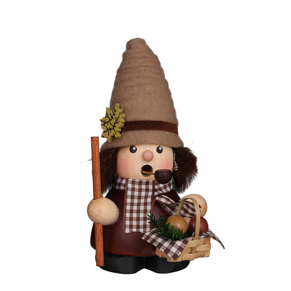 Christian Ulbricht Mushroom Picker Smoker holding a basket of mushrooms and a walking stick, wearing a felt hat with oak leaf accent and plaid scarf, handcrafted in Germany.