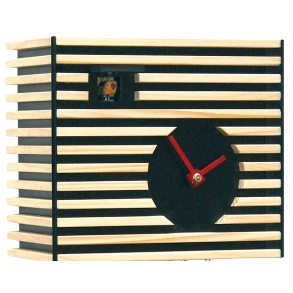Close-up of BAUHAUS black cuckoo clock with wooden slats and visible cuckoo bird.