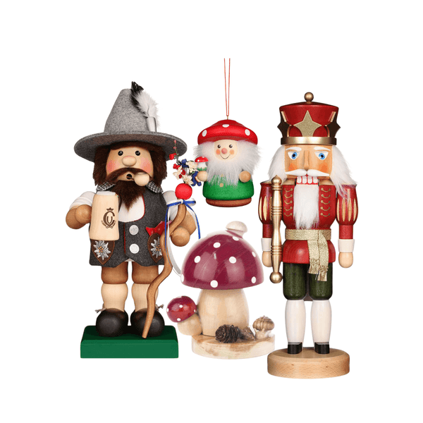 Handcarved German incense smokers, nutcracker figurines, and wooden wobble figures.