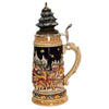 side of German beer stein with Santa sleigh scene, reindeer, snowy forest, and ceramic Christmas tree lid topped with a golden star.