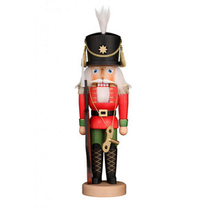 Christian Ulbricht toy soldier nutcracker. In his nice uniform and with his toy rifle he is ready to guard the toys. Around his neck he has a wind up key . 