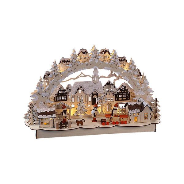 This wooden Pfaff Christmas Schwibbogen is 10.6x18x5 inches and uses battery powered LED lights. The arch, decorated with trees and snowcapped houses, spans above a church and a village with snowcapped roofs. Three children are skiing, sledding and making snow balls, completed by a dog and toy train in the front.
