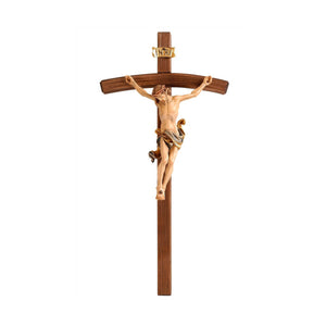 Carved wooden crucifix, depicting the body of Christ in a style reminiscent of Leonardo Da Vinci, painted in a variety of colors with gold accents.