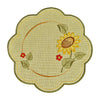 Round sand color table linen with scalloped edges, and a design of a sunflower with leaves and small flowers.