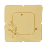 Square cream color table linen with indents in the outer border, and an interior gold border with a design of Christmas flowers and berries and gold stars.