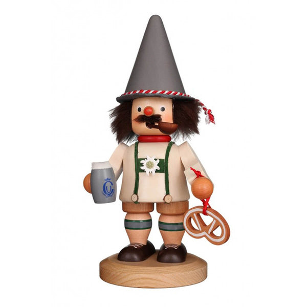 Hand-carved wooden German smoker dressed as a Bavarian with a grey hat, white jacket, brown shorts, holding a beer stein and a pretzel.