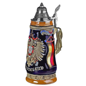 King Beer stein with German Flag on the side where the gold color is shining. On the front is an impressive German Eagle with the word "Deutschland" underneath. The handle looks like a vine with a pewter lid attached.