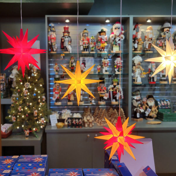 Illuminated Herrnhuter Stars with German nutcrackers and Christmas decorations