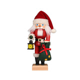 Christian Ulbricht Nutcracker Santa Claus with Lantern, dressed in red coat, holding a green gift sack and lantern, embodying festive holiday charm.