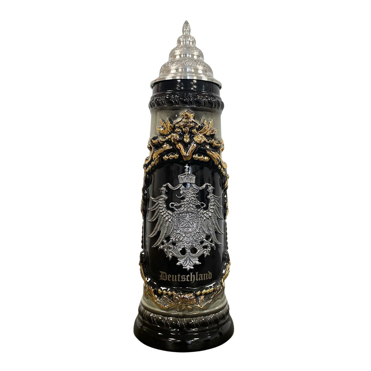 Decorative beer stein with intricate designs and 'Deutschland' text on a white background