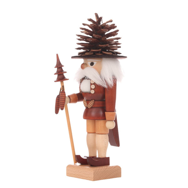 Christian Ulbricht Coneman Natural nutcracker side view with pine cone hat, wooden staff with carved tree, and warm natural wood tones, handmade in Germany