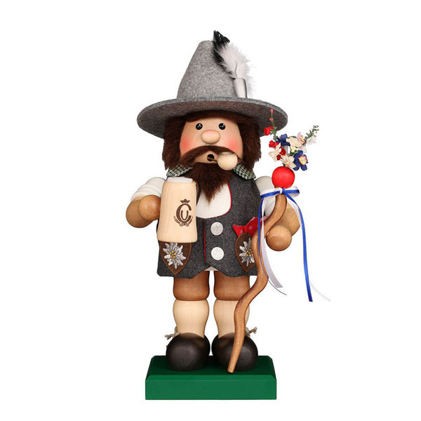 Handcrafted Bavarian smoker by Ulbricht, featuring a beer mug, traditional trachten outfit with edelweiss hearts, and a decorative walking stick.
