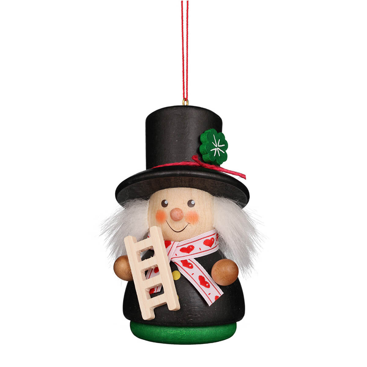 Wobbly man chimney sweep with black hat and black jacket. A green clover leaf is stuck on his hat. In his hand he holds his ladder and around his neck he wears a white scarf with red hearts.