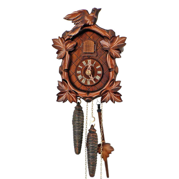 1-Day Schneider Traditional Coocoo clock without music. The face of the brown clock is crosshatched. There are carved leaves with lighter colored carved lines on each of the four corners of the clock. The distinctive feature of this clock is the oval shaped rounded clock face. The cuckoo door above the dial opens when the cuckoo bird calls. There is a larger carved cuckoo bird sitting on top of the crown on the roof.
