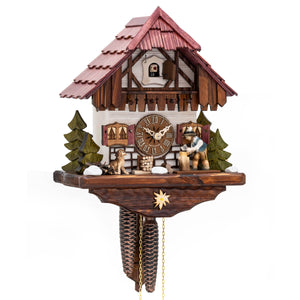 Charming cuckoo clock featuring a woodcutter chopping wood with his loyal dog by his side, set against a backdrop of alpine chalet and fir trees.