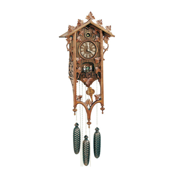 Wooden cuckoo clock with detailed design on a white background