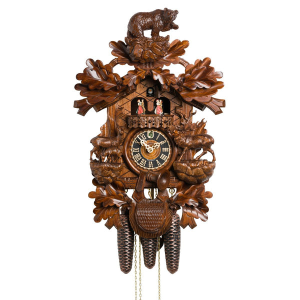 Hönes 8-day Black Forest cuckoo clock with carved bear, deer, spinning dancers, and traditional woodland design.