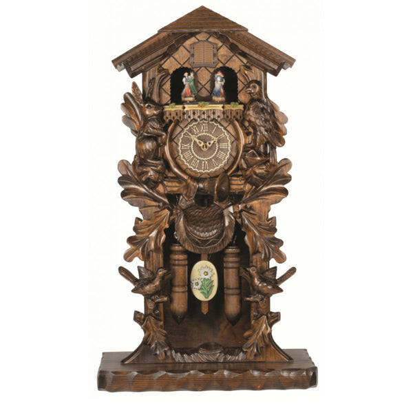 Trenkle quartz cuckoo clock with dancing couples, carved oak leaves, cuckoo bird, pinecone weights, and traditional Black Forest styling.