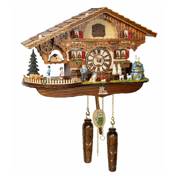Trenkle quartz cuckoo clock with Heidi theme, Swiss chalet design, goats, mountain backdrop, cuckoo bird, and pinecone weights.