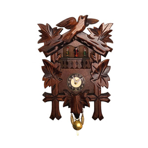 Miniature quartz traditional cuckoo clock framed by ivy leaves, with a bird carved atop, and dancers that tick around.