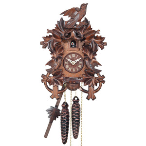 Leaves frame a Traditional Engstler Cuckoo Clock with carved Birds on Top and in a Nest on the bottom