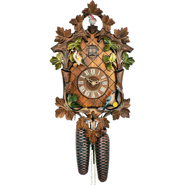 8-day Black Forest cuckoo clock by Anton Schneider featuring moving birds, hand-painted green leaves, and traditional carved design, handcrafted in Germany.