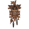 Five Ivy Leaves on a Traditional Engstler Black Forest Cuckoo Clock with carved Bird and Dancers on Top