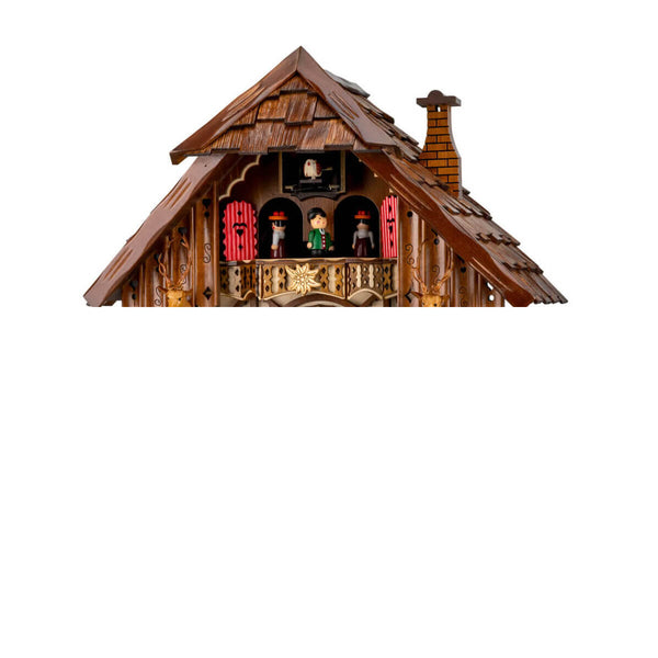 Close-up of Engstler Cuckoo Clock balcony with dancers, cuckoo bird, two deer heads with antlers, and an edelweiss decoration.