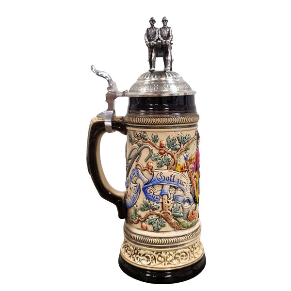 Firemen Beer Stein featuring sculpted firefighter figures, antique fire engine lid, and handcrafted German relief artwork