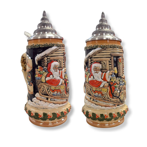 German Christmas beer stein with Santa Claus in a sleigh, festive house scene and 24-karat cherub handle by KING Werk