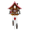 Christmas chalet cuckoo clock with white-shutter cuckoo window, Santa, sleigh, snowman, red and white pendulum, and golden star by Trenkle.