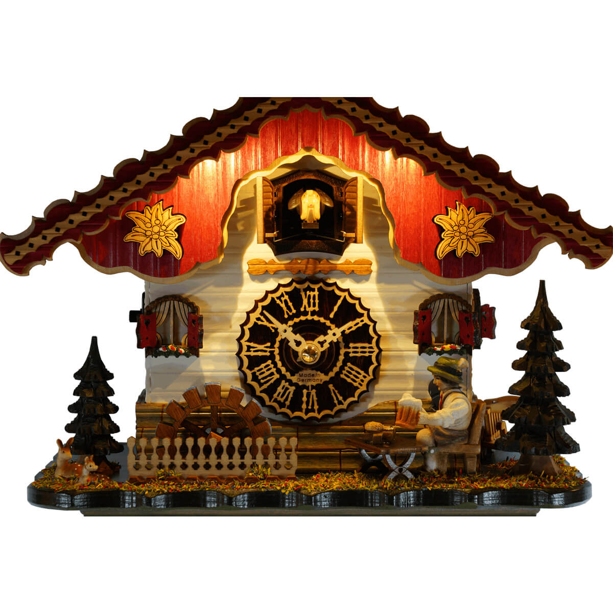 Trenkle chalet-style cuckoo clock warm lights illuminating the cuckoo bird.