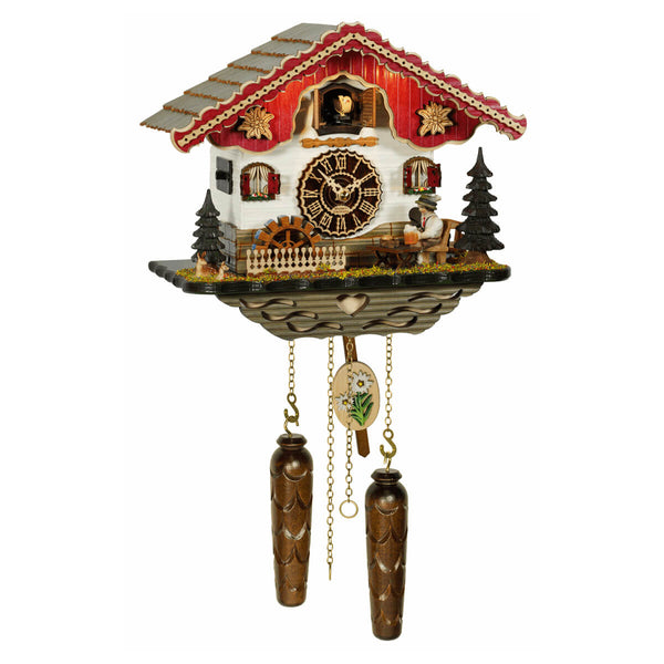 Trenkle chalet-style cuckoo clock with red roof, beer drinker figure, moving waterwheel, edelweiss decor, and warm lights illuminating the cuckoo bird.