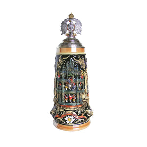 German beer stein with detailed Glockenspiel scene, Munich landmarks, ornate scrollwork, and pewter lid topped with Imperial German Eagle.