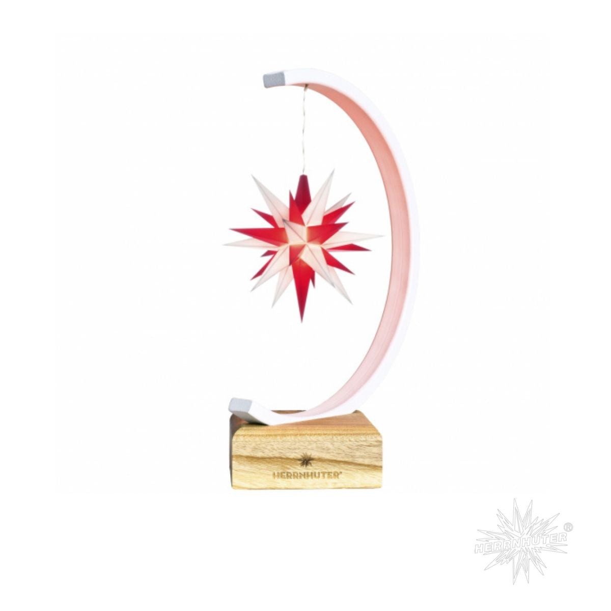 Herrnhuter Sternenbogen with illuminated red and white Moravian star on white arch and wooden base