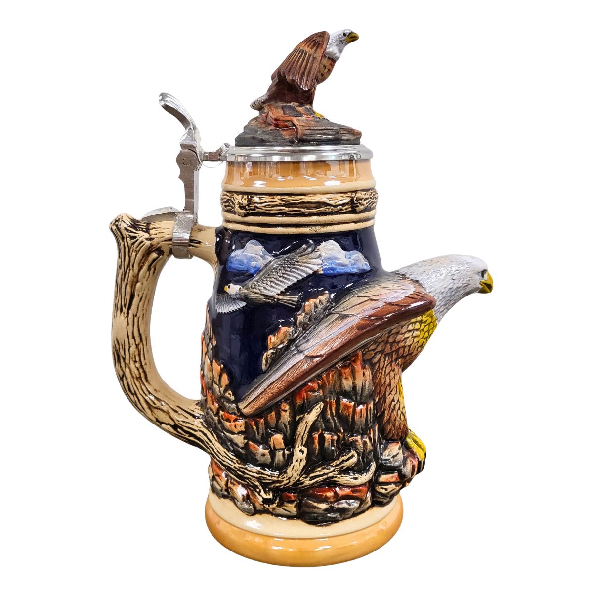 German handcrafted Bald Eagle Beer Stein with raised relief artwork and pewter-mounted eagle lid