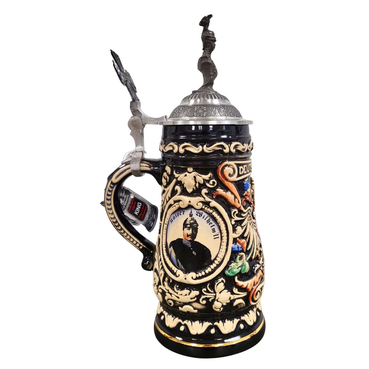 Black Beer Stein with silver accents and a portrait of Wilhelm II .The Pewter Lid is topped with a bust of Wilhelm II