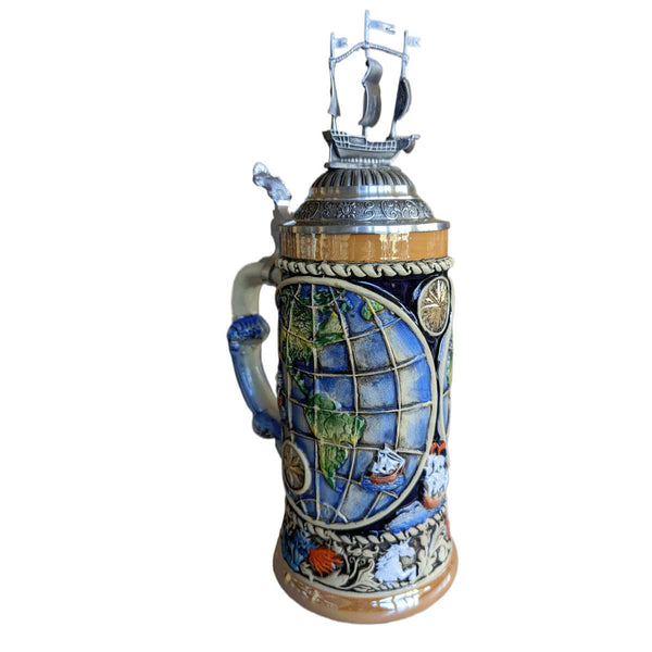 Beer Stein with an old-world map and the ships of the explorers of that time. The lower rim is decorated with signs of the four elements representing Fire, Earth, Wind and Water. The pewter lid is decorated with a globe and an imposing sailing ship.