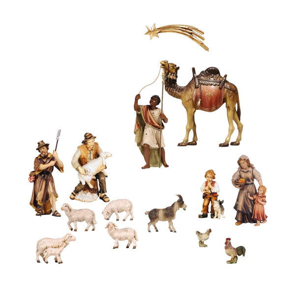 PEMA Kostner nativity expansion set with 14 hand-carved figures including shepherds, animals, camel, and comet, made from sycamore maple and oil-painted in Val Gardena, Italy.