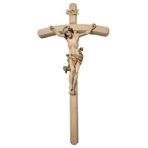 Carved wooden crucifix, depicting the body of Christ in a style reminiscent of Leonardo Da Vinci, painted in natural colors.