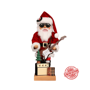 This Modern Santa Claus has a red coat with a red hat on. The white fur on the edges of the jacket and the hat matches perfectly with his white beard. With the dark sunglasses and the electric guitar he competes with every rock star. A small Christmas tree stands on the amplifier and a small gift is waiting to be opened. Limited Edition!