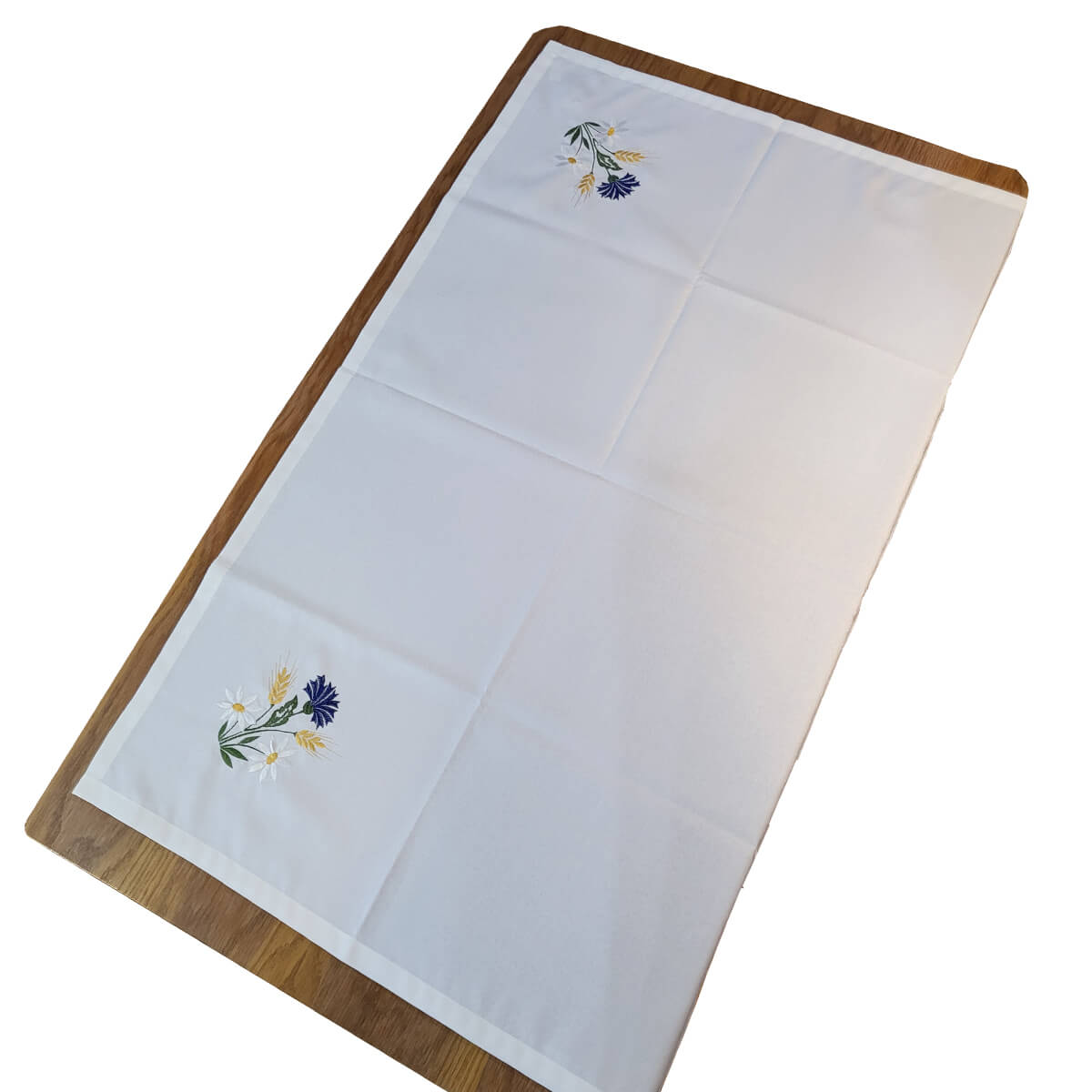 White linen tablecloth with cornflower, daisy, and barley embroidery in the corners, full size rectangular design
