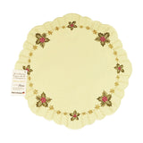 Round champagne color table linen with scalloped edges, and a border design of holly and leaves with Christmas stars alternating between them.