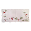 White embroidered linen table runner featuring traditional bleeding heart flowers, green vine accents, and scalloped edges in a German-inspired floral design.