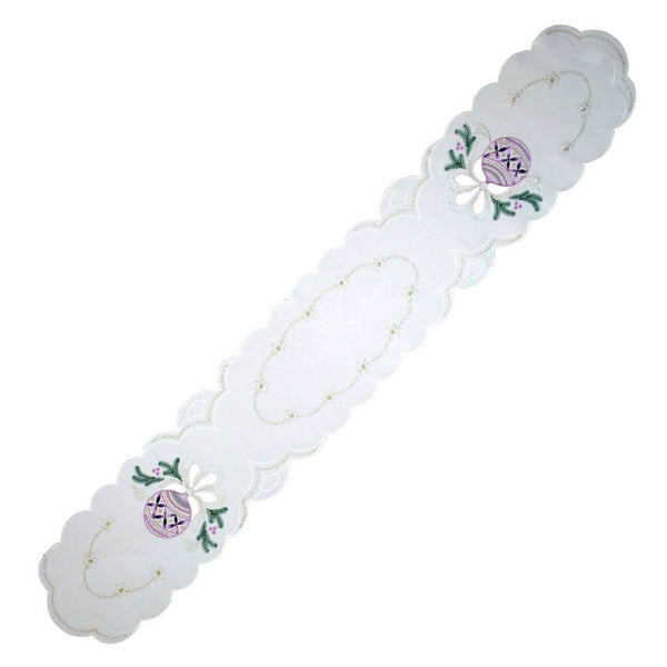 Long linen runner with purple ombre ornaments, pine branches, golden stars, and elegant cutout detailing. 9x53 inches (23x135 cm), made in Germany.

