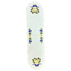 White table runner with scalloped edges, with bouquets of spring flowers on either end, and designs of flowers and leaves along the border in the center.
