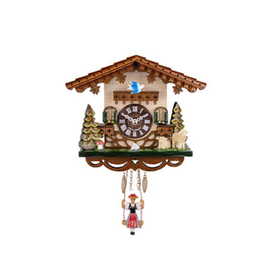 This Mini Clock by Engstler showcases a charming miniature design. With earthy tones and intricate gingerbread woodwork, it portrays a delightful scene with two sheep, pine trees, a toadstool, and a bird that sways in time to the pendulum. Adding to its whimsical appeal, it boasts a traditionally dressed Black Forest Girl as a pendulum