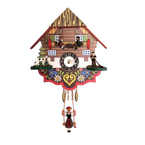 This beautiful miniature quartz clock is the perfect way to add a touch of Alpine charm to your home. Crafted by Engstler, it features bright colors and floral designs. A boy and girl swing up and down on a see-saw to the beat of the pendulum which is shaped into a Black Forest girl in traditional clothing. The addition of the St. Bernard and the Alphorn player add authenticity and complete the scene.